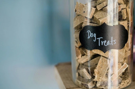 jar filled with dog treats biscuits showing pet snack storage and healthy dog treat options